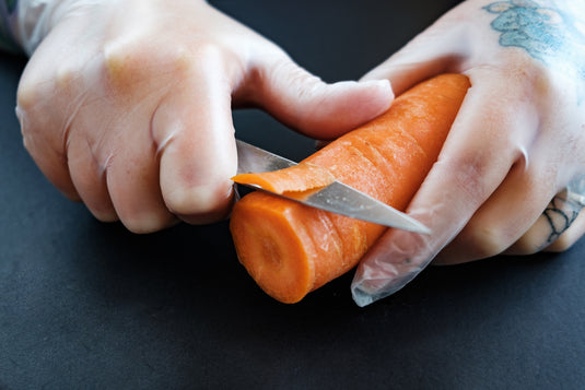 tattooed-hands-cut-a-carrot - MADOVERBIKING